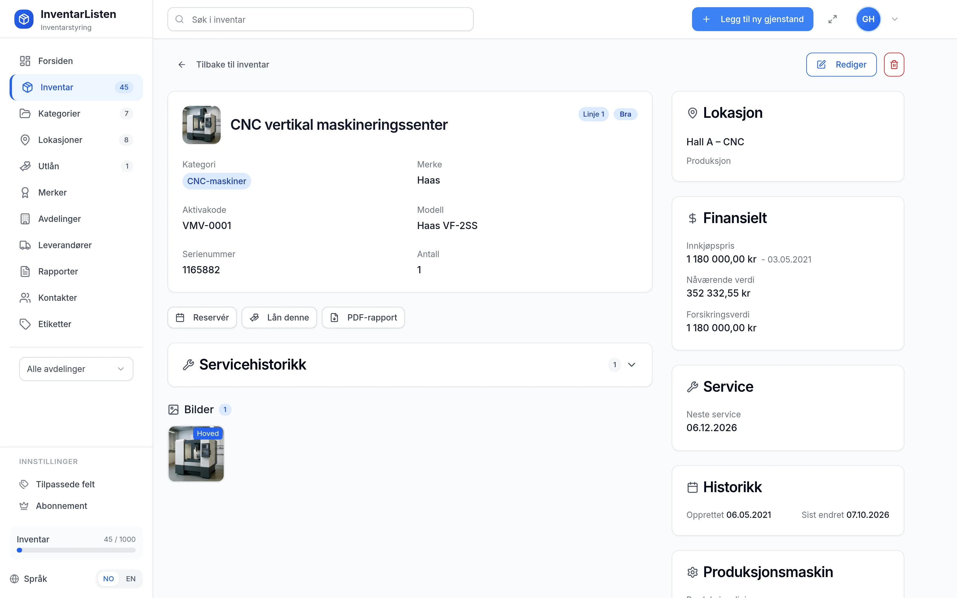 Detaljside for et inventarelement hos produksjon-og-industri – verdi, service, garanti og egendefinerte felt